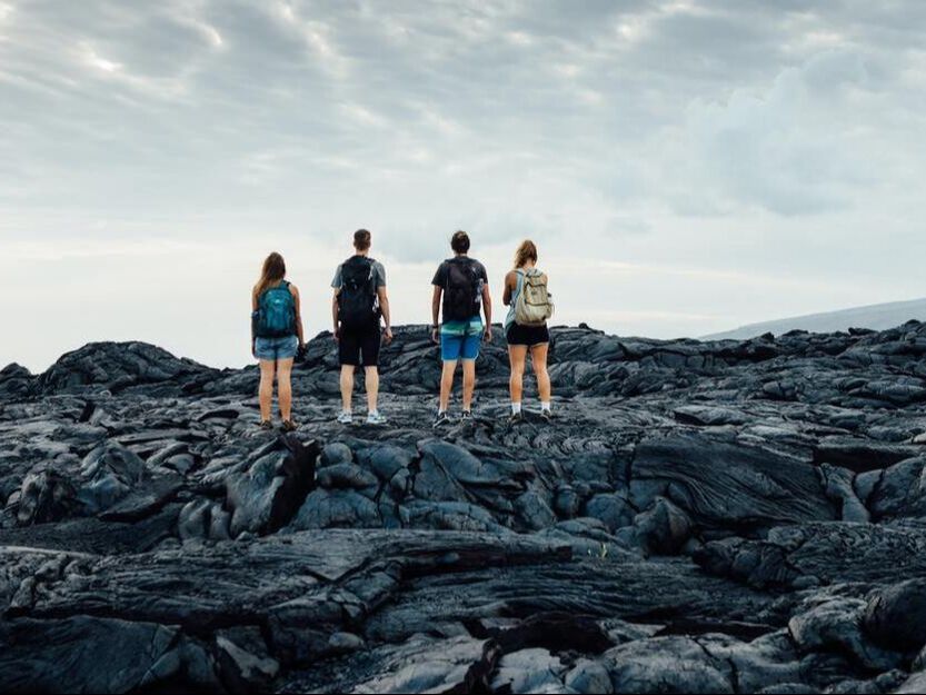 People standing on Lava in Hawaii